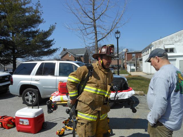 Firefighter Mike Nelson dropping his pack.